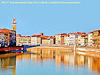 A beautiful view of the Arno river flowing across the town of Pisa