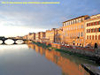 A beautiful view of a sunset on the Arno river crossing Florence.